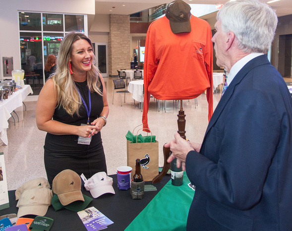 Heartland Heritage owner speaking with guest after completing LAB program.